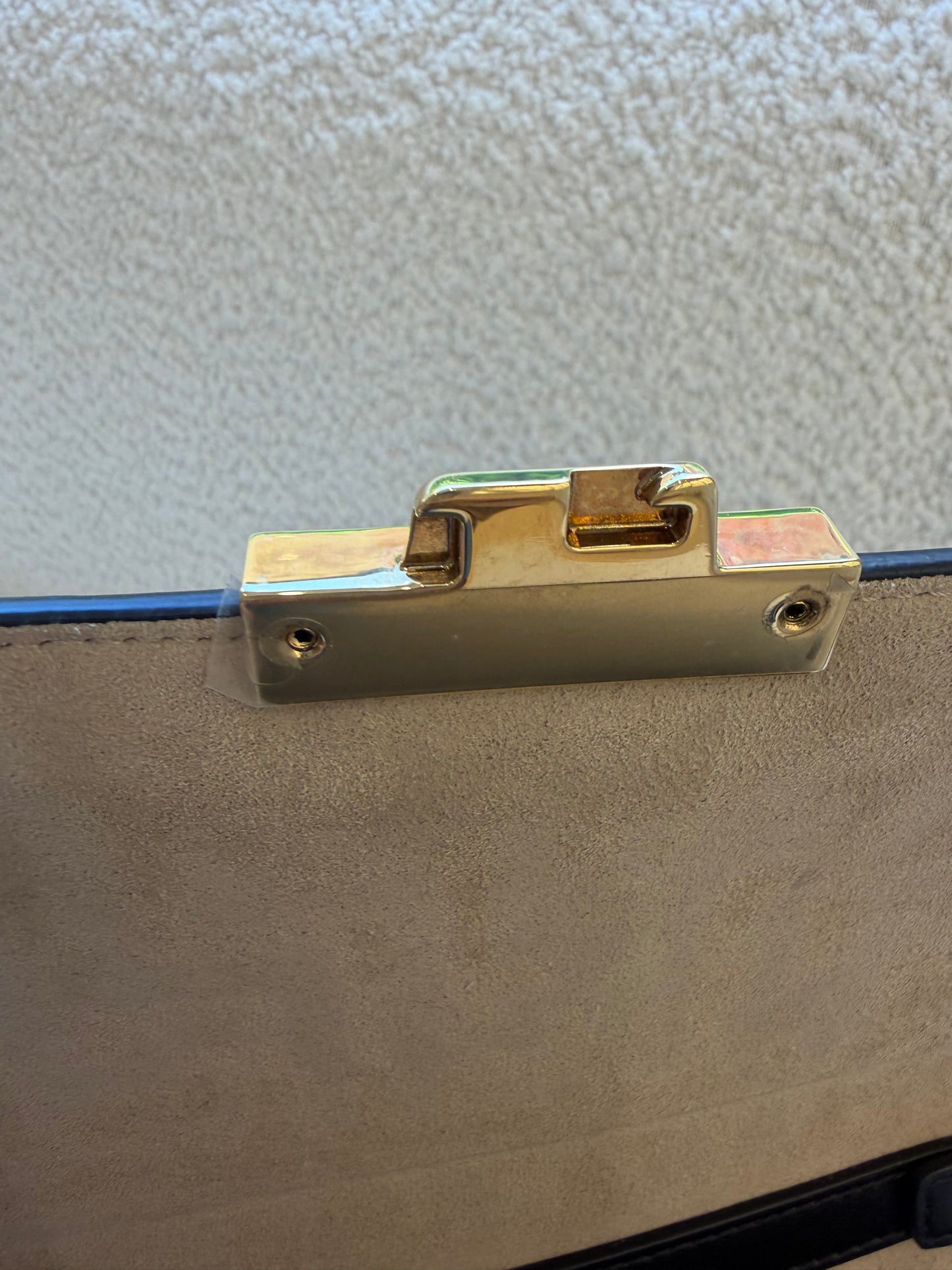 Fendi bag with the FF embossed pattern and FF turn-lock hardwear