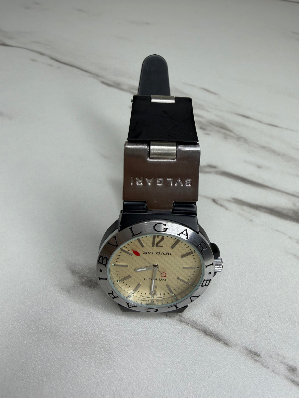 Bvlgari Diagono Titanium Automatic Watch with a cream dial and black rubber strap.