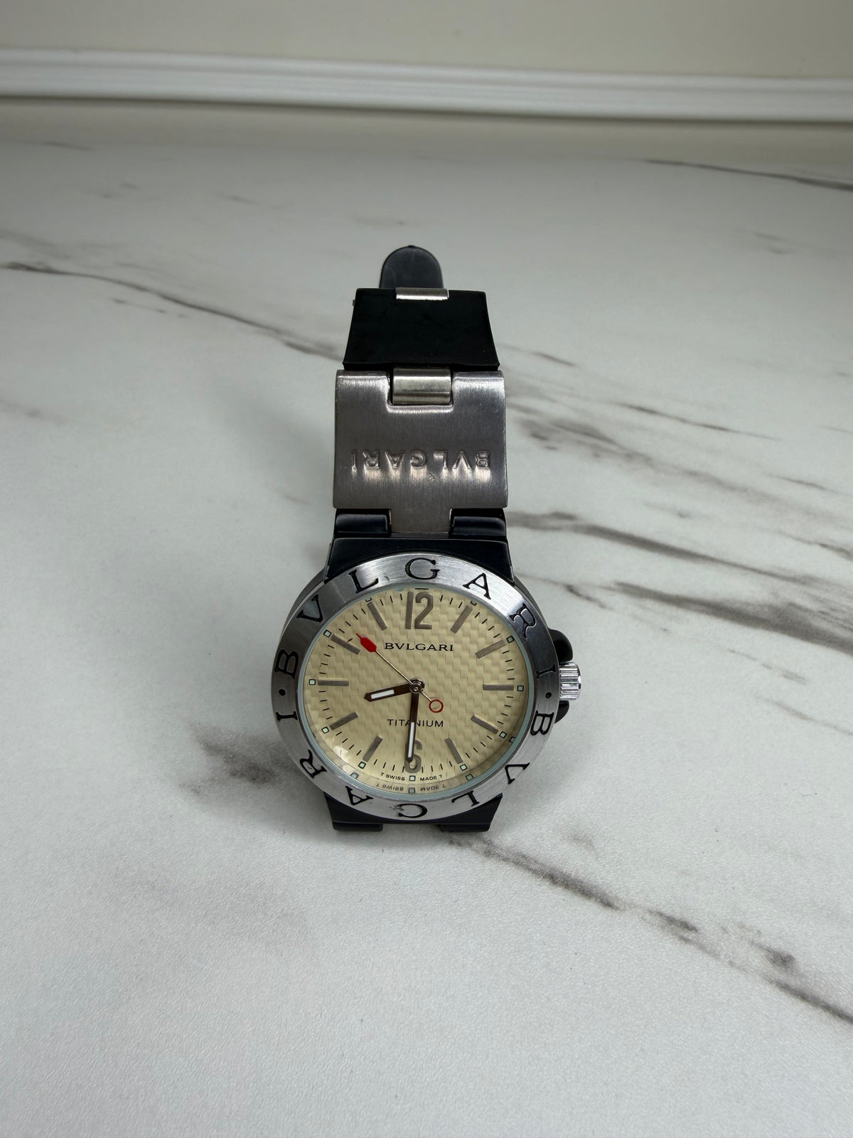 Bvlgari Diagono Titanium Automatic Watch with a cream dial and black rubber strap.