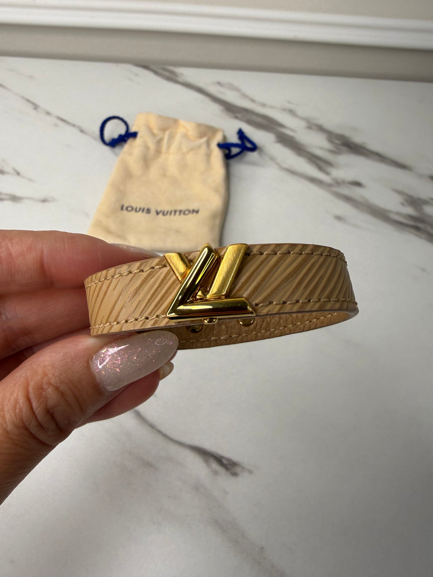 Louis Vuitton Camel Epi Leather Twist Bracelet with a gold-toned logo turn lock