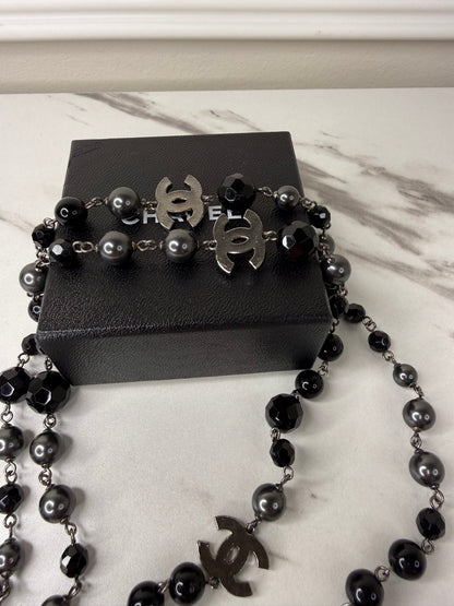 Chanel CC Logo long necklace featuring black and grey beads