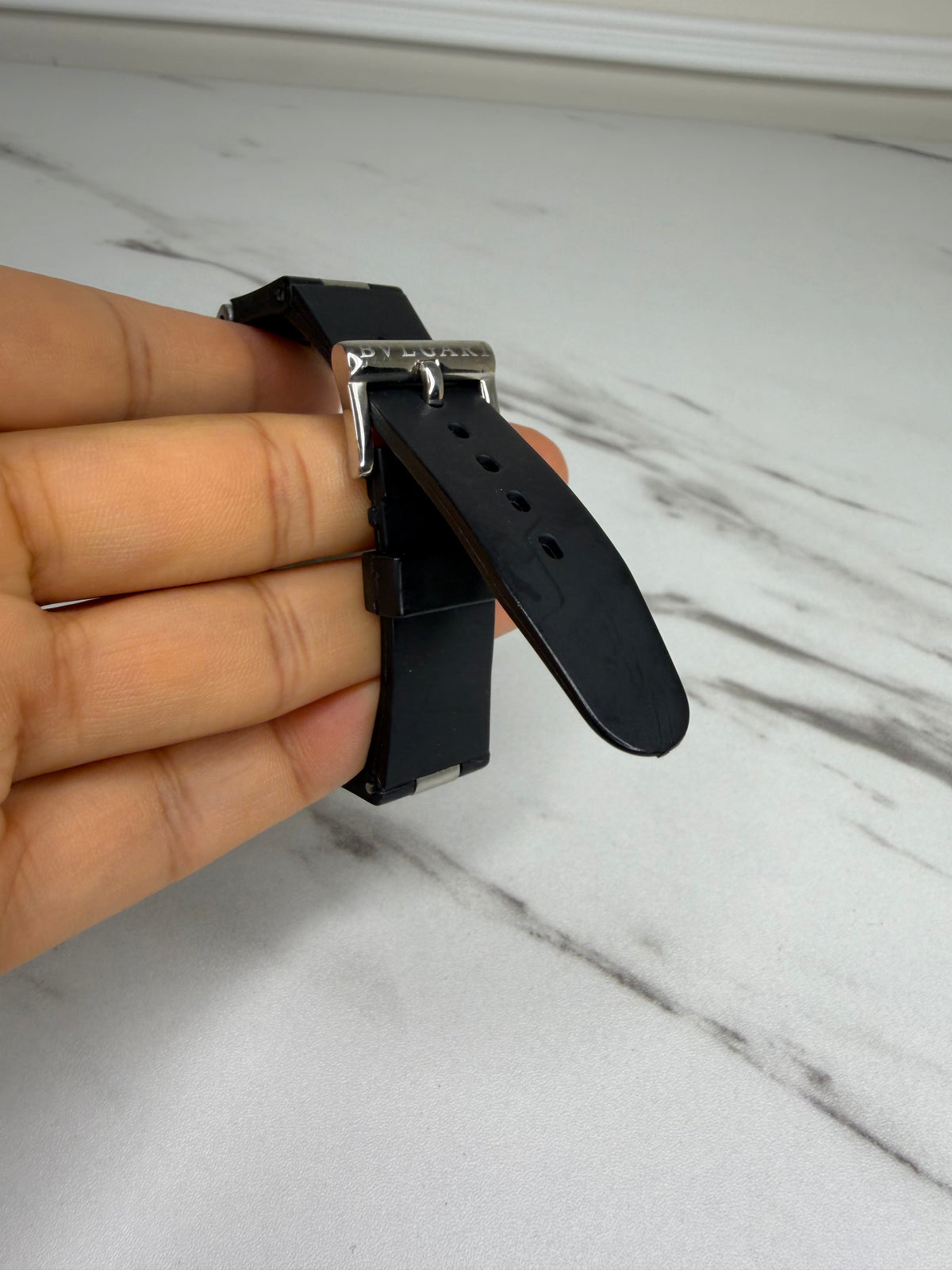 Bvlgari Diagono Titanium Automatic Watch with a cream dial and black rubber strap.