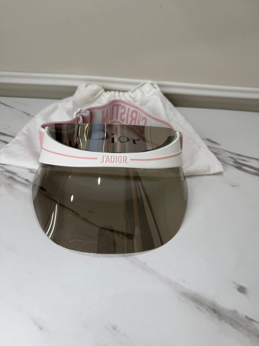 Dior Club 1 sun visor in pink and white with a grey lens