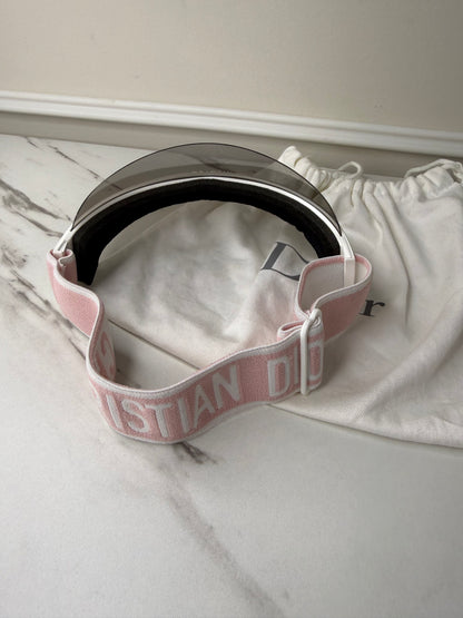 Dior Club 1 sun visor in pink and white with a grey lens