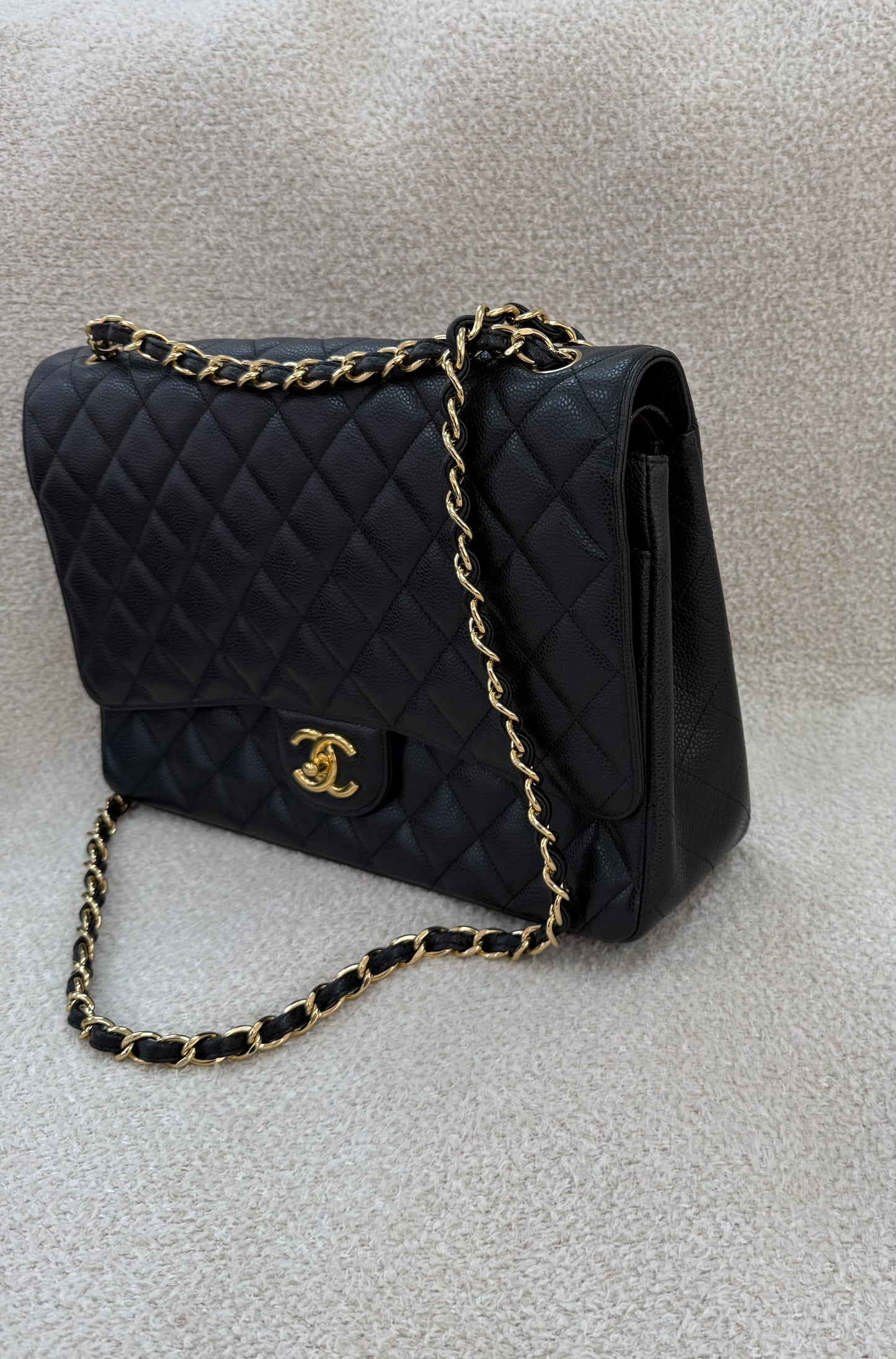 Chanel caviar maxi classic flap black gold
