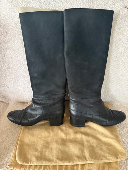 Chanel black tall riding boots featuring quilted leather details and a CC logo