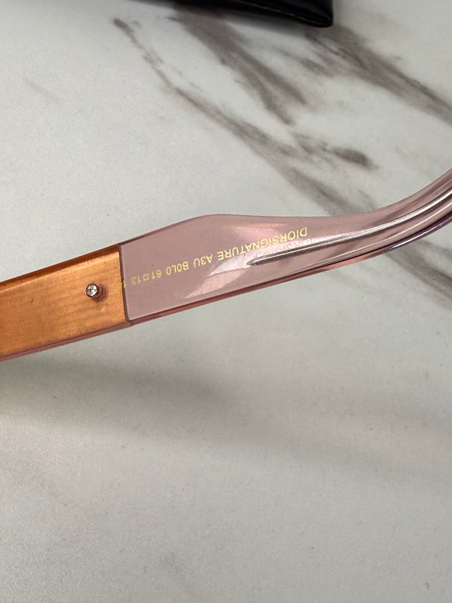 DiorSignature S5U sunglasses featuring gold frames and pink lenses