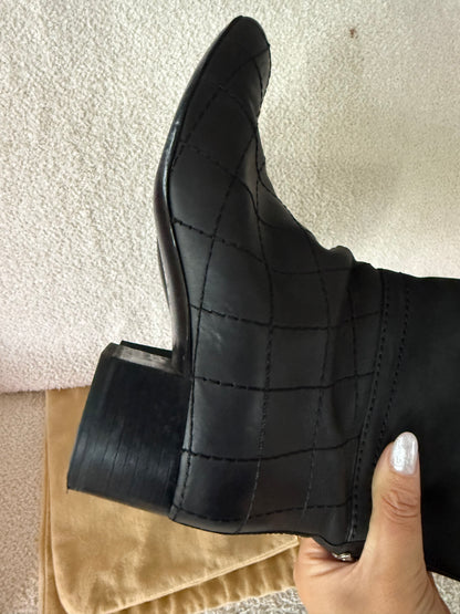 Chanel black tall riding boots featuring quilted leather details and a CC logo