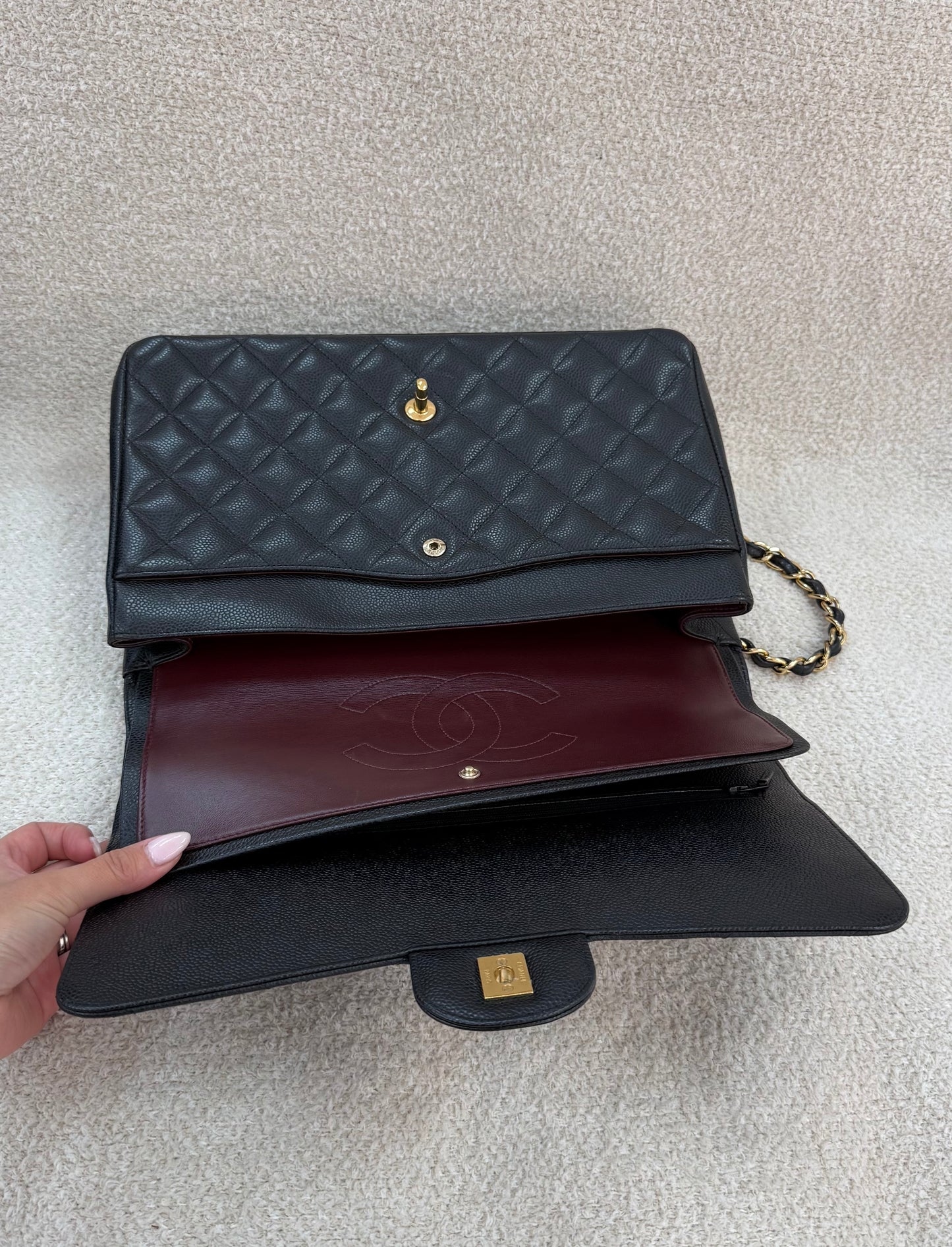 Chanel caviar maxi classic flap black gold