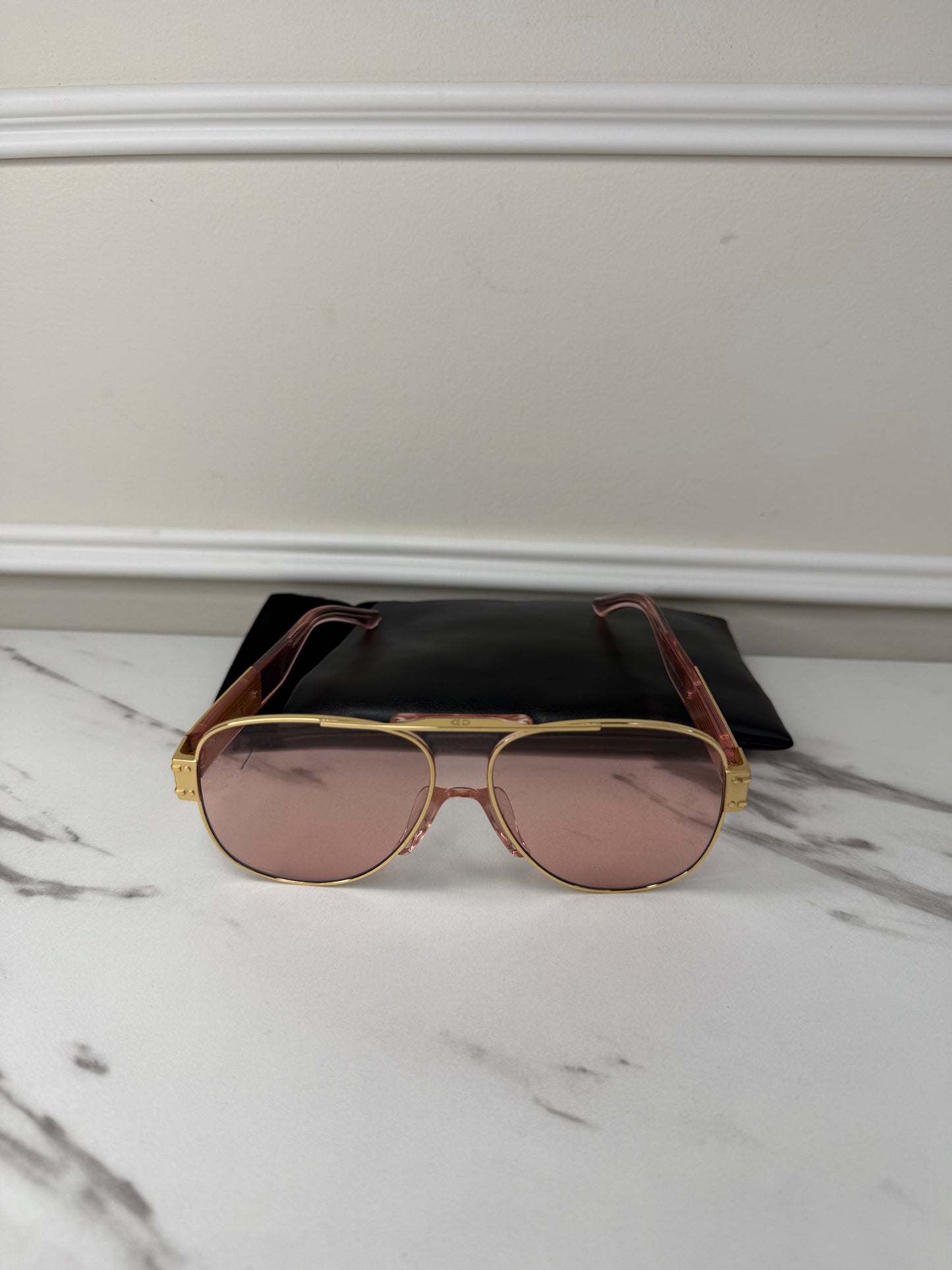 DiorSignature S5U sunglasses featuring gold frames and pink lenses