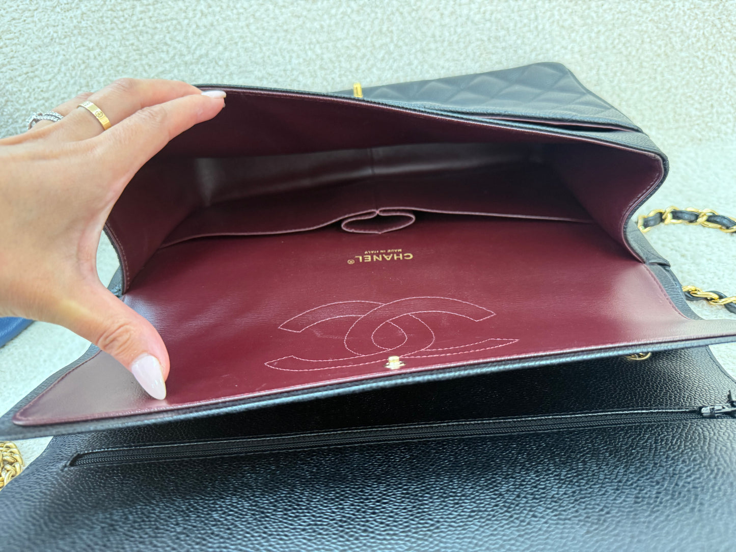 Chanel caviar maxi classic flap black gold