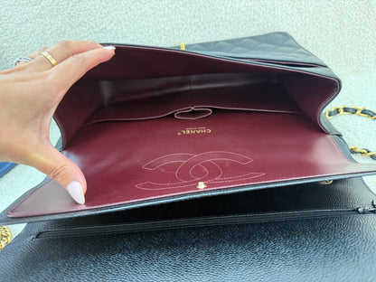 Chanel caviar maxi classic flap black gold
