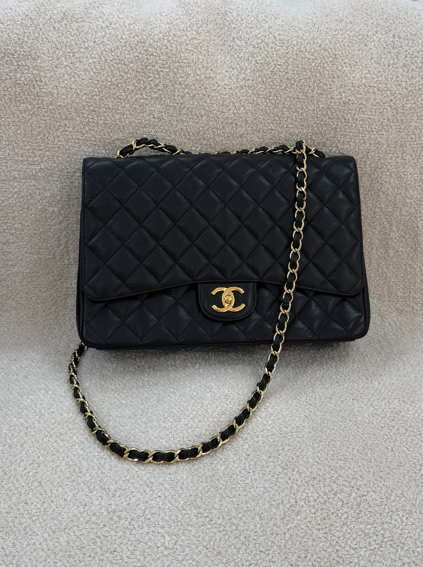 Chanel caviar maxi classic flap black gold