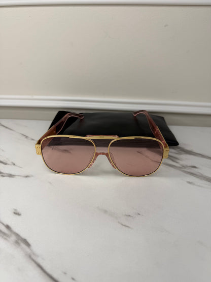 DiorSignature S5U sunglasses featuring gold frames and pink lenses