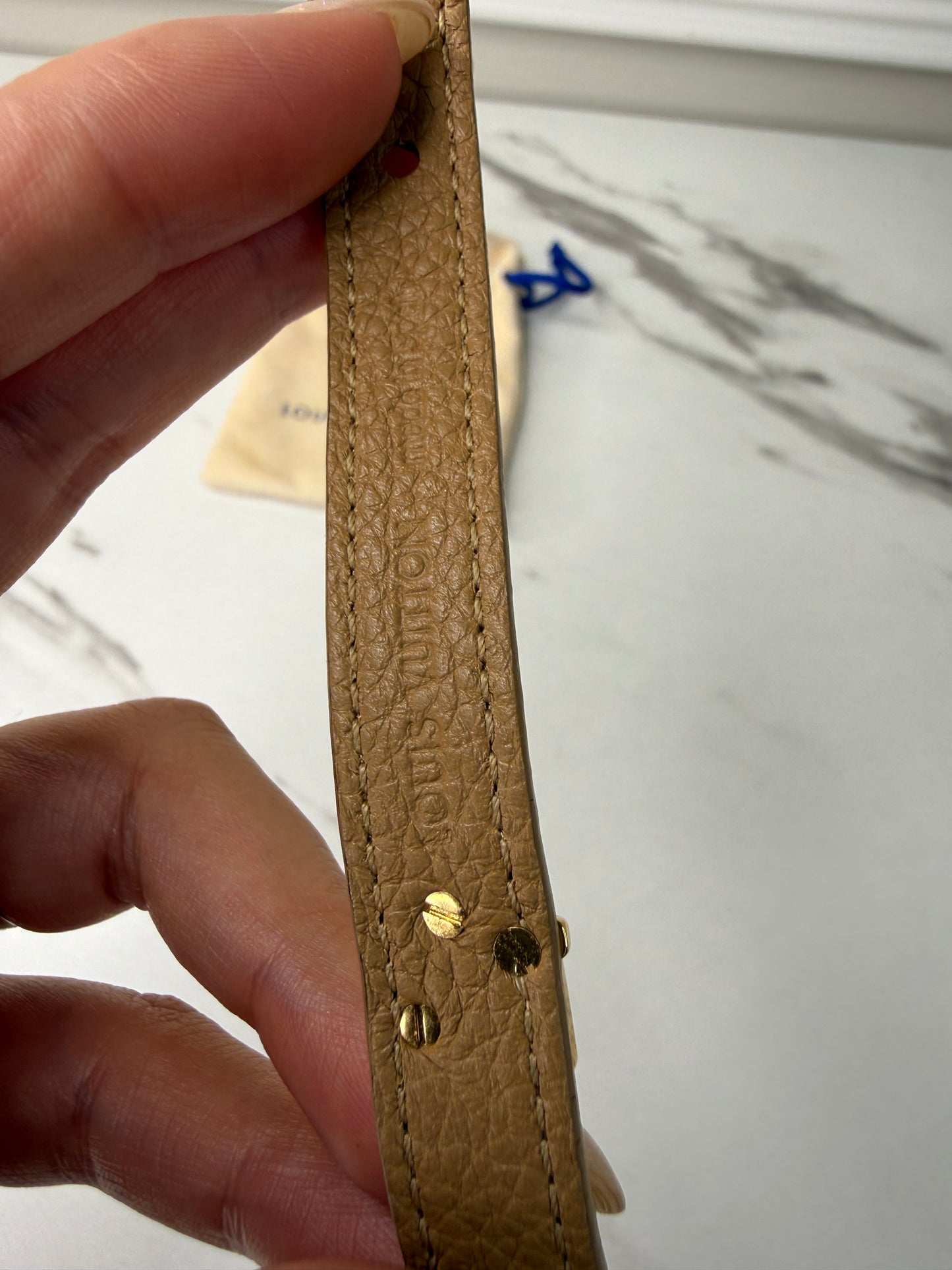 Louis Vuitton Camel Epi Leather Twist Bracelet with a gold-toned logo turn lock