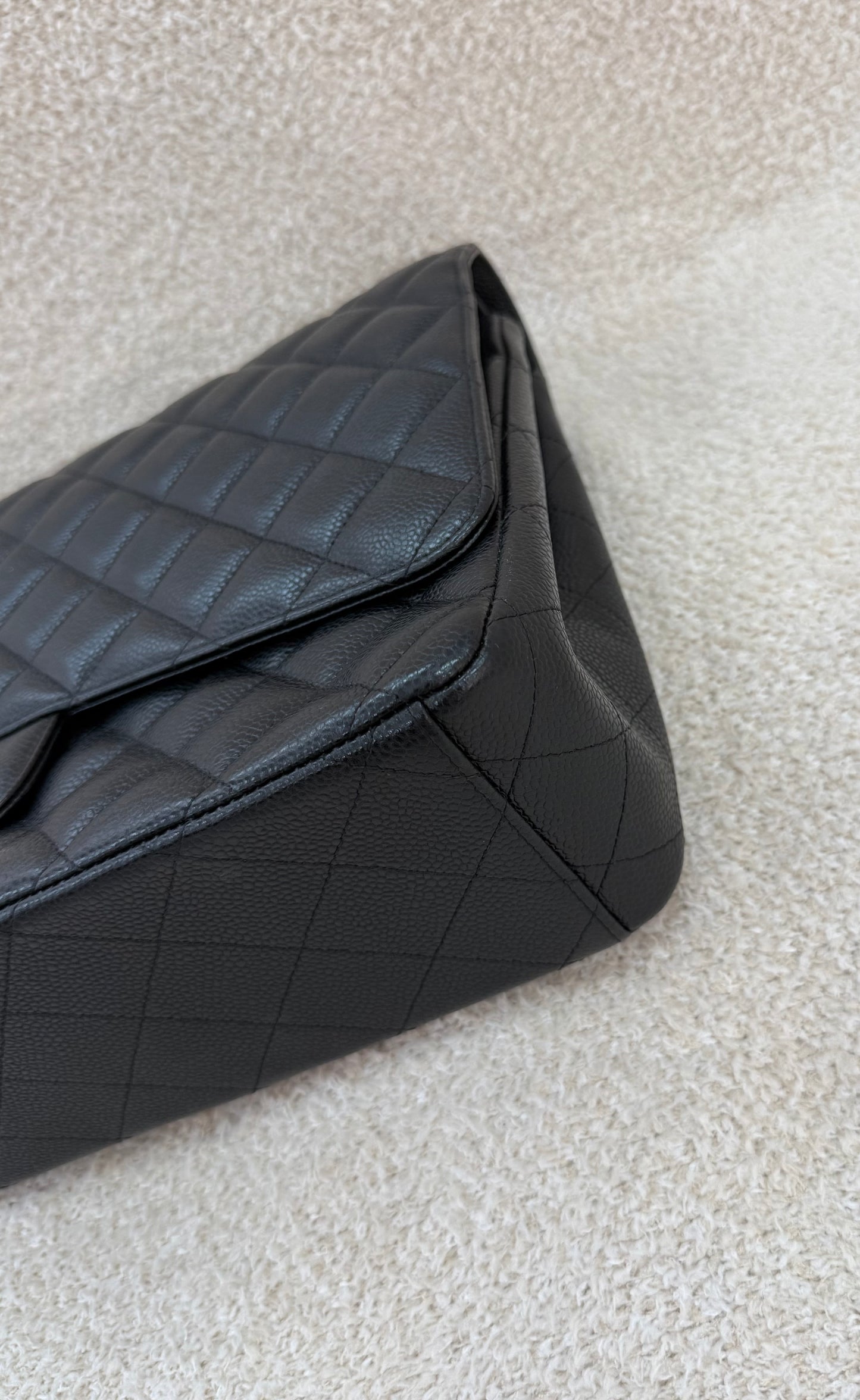 Chanel caviar maxi classic flap black gold