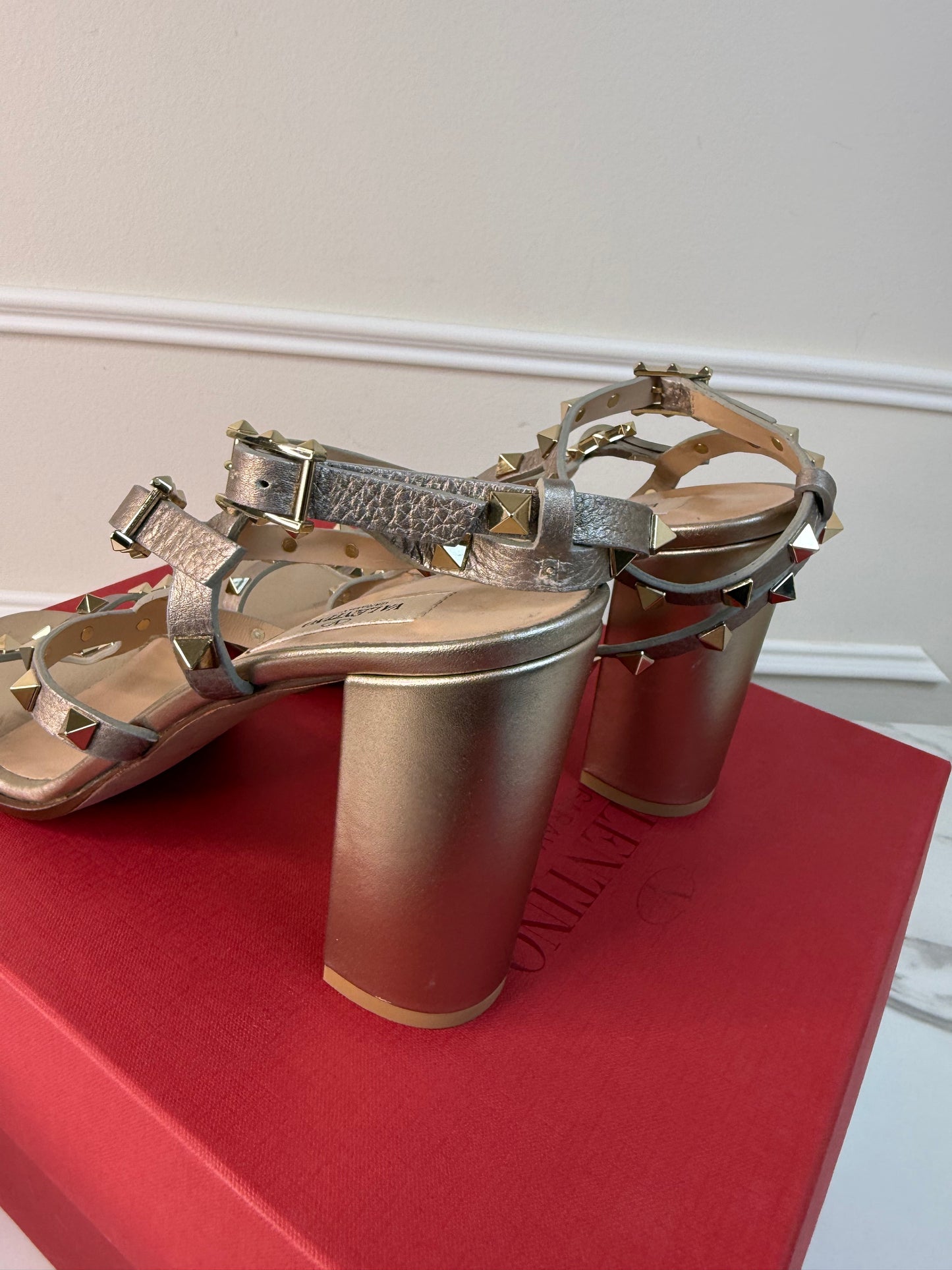 Valentino Garavani Rockstud block heel sandals in a metallic gold size 40