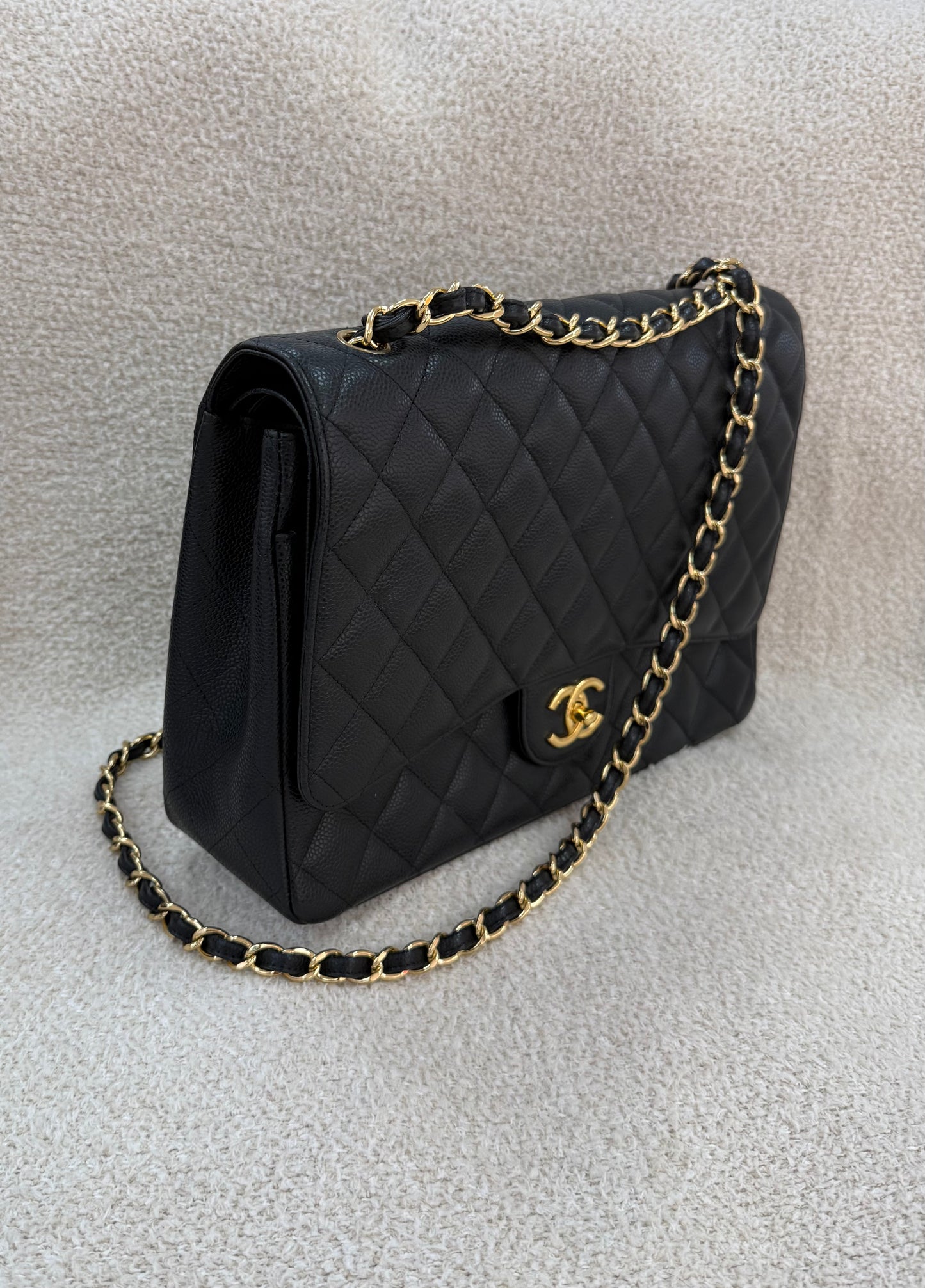 Chanel caviar maxi classic flap black gold