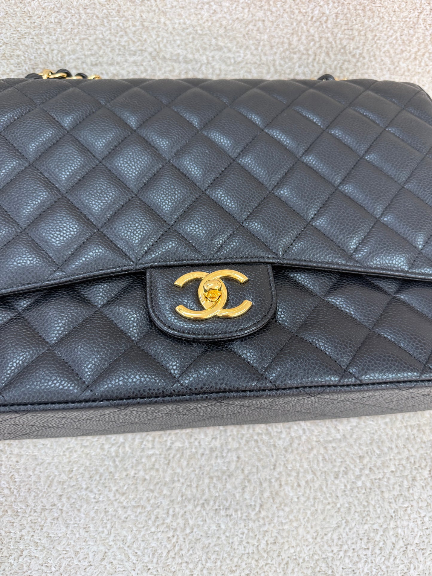Chanel caviar maxi classic flap black gold
