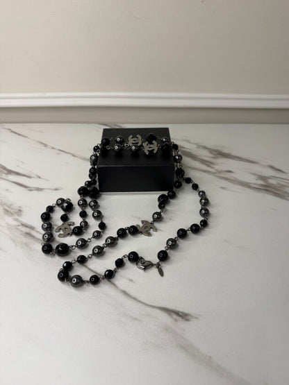 Chanel CC Logo long necklace featuring black and grey beads