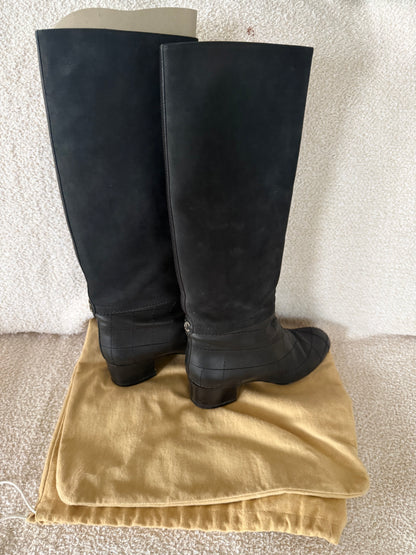 Chanel black tall riding boots featuring quilted leather details and a CC logo
