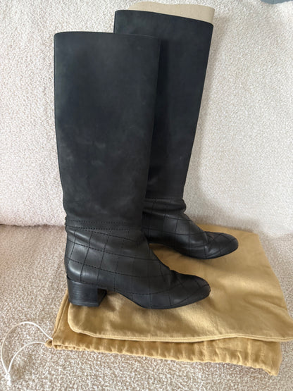 Chanel black tall riding boots featuring quilted leather details and a CC logo