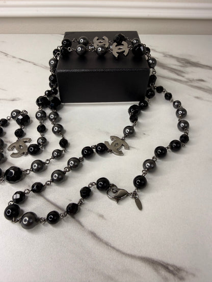 Chanel CC Logo long necklace featuring black and grey beads