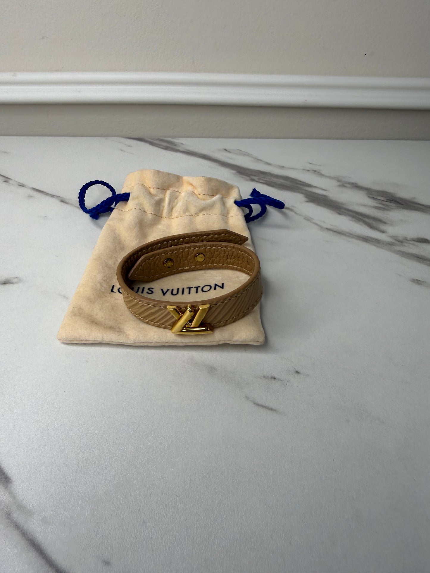 Louis Vuitton Camel Epi Leather Twist Bracelet with a gold-toned logo turn lock