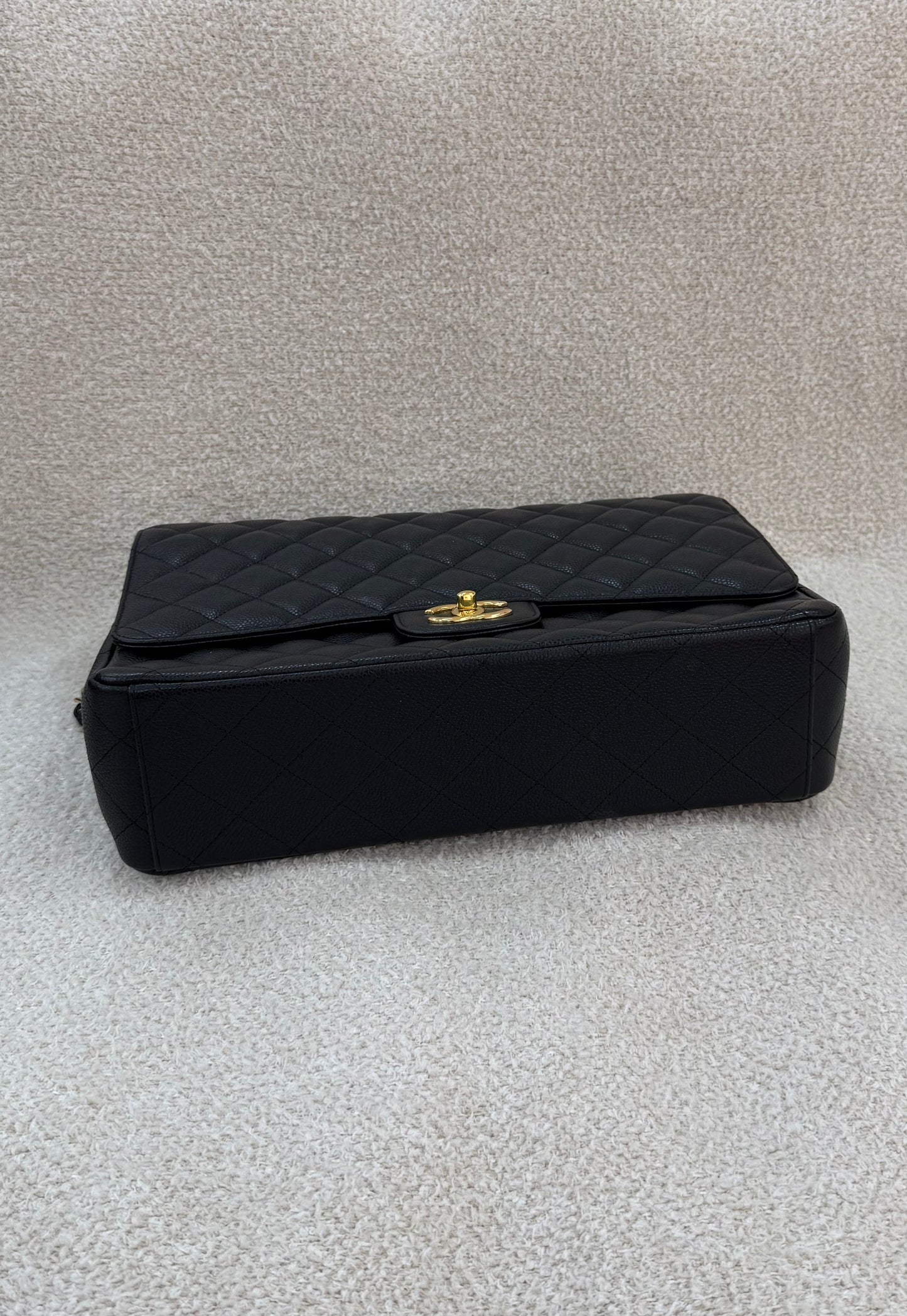 Chanel caviar maxi classic flap black gold