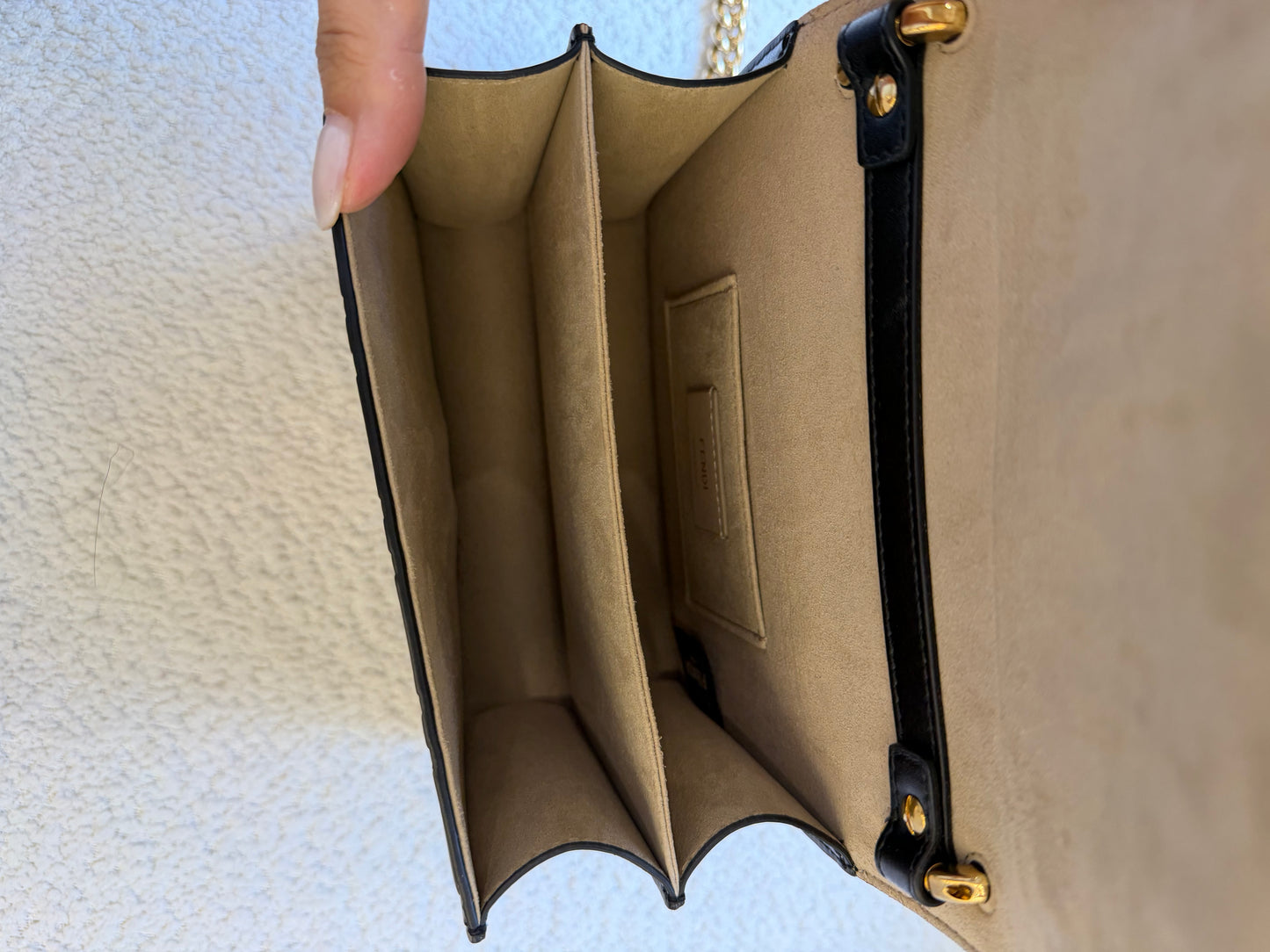 Fendi bag with the FF embossed pattern and FF turn-lock hardwear