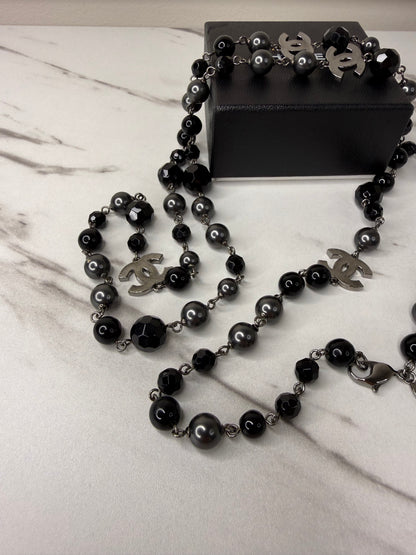 Chanel CC Logo long necklace featuring black and grey beads