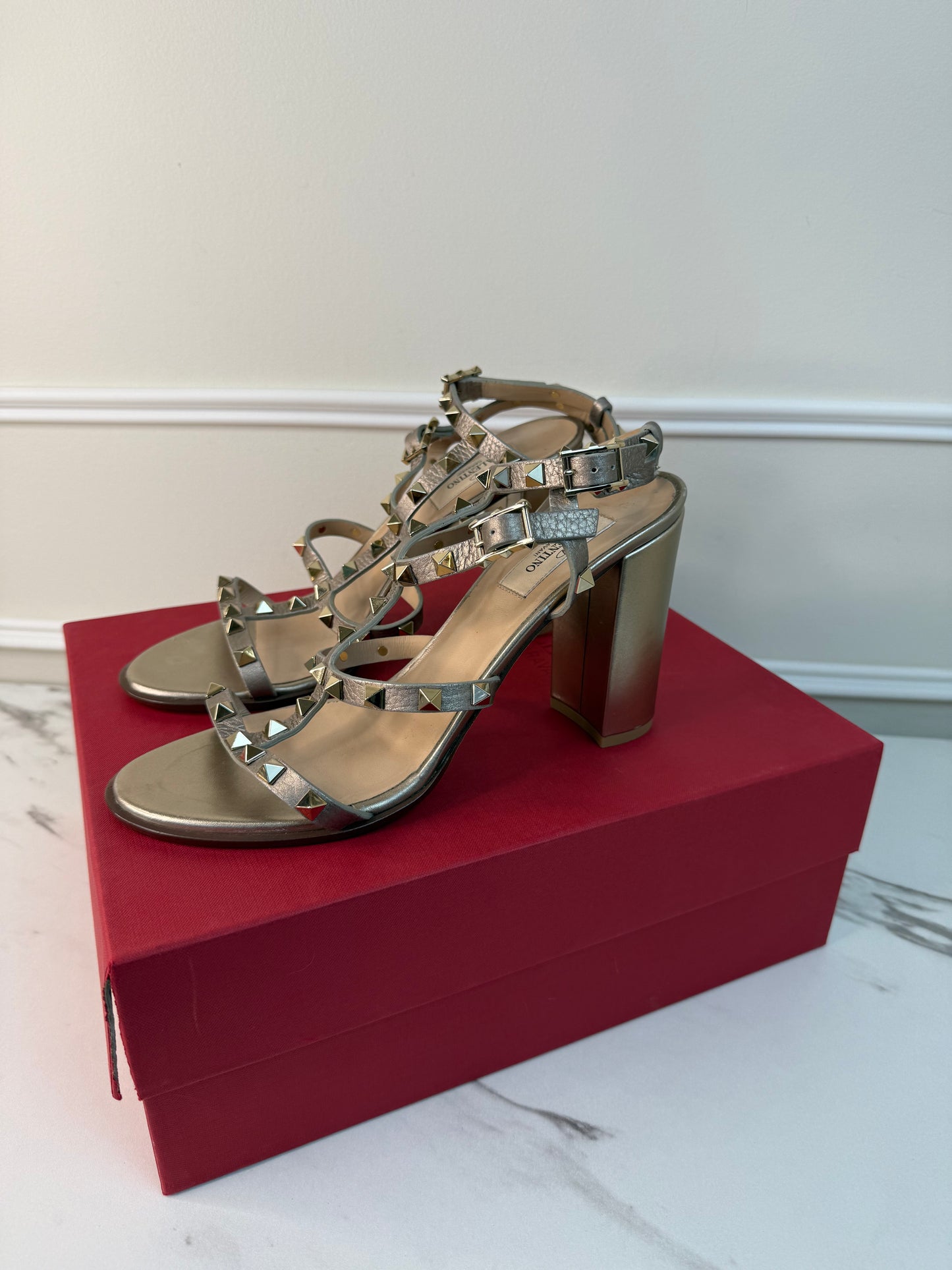 Valentino Garavani Rockstud block heel sandals in a metallic gold size 40