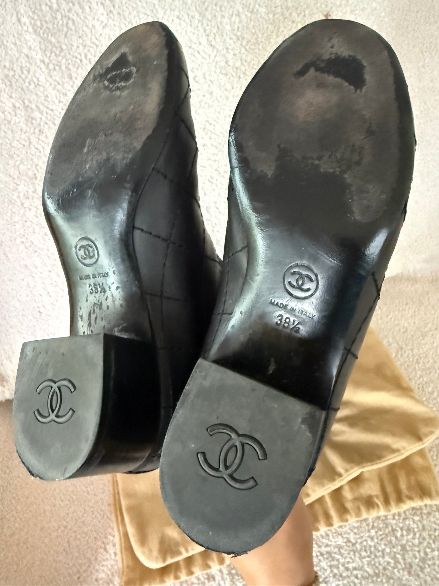 Chanel black tall riding boots featuring quilted leather details and a CC logo