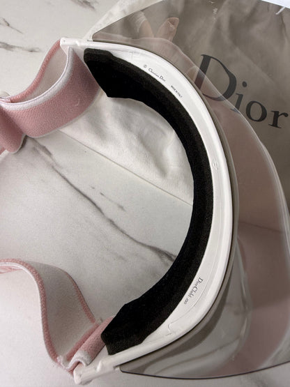 Dior Club 1 sun visor in pink and white with a grey lens